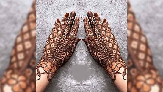 Mehndi covers hands of beautiful Indian woman Stock Photo - Alamy