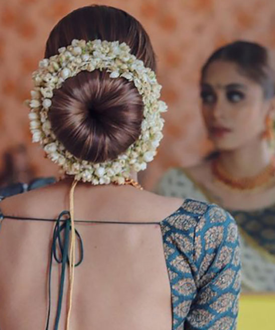 Messy Bun Hairstyle for Saree with Flowers
