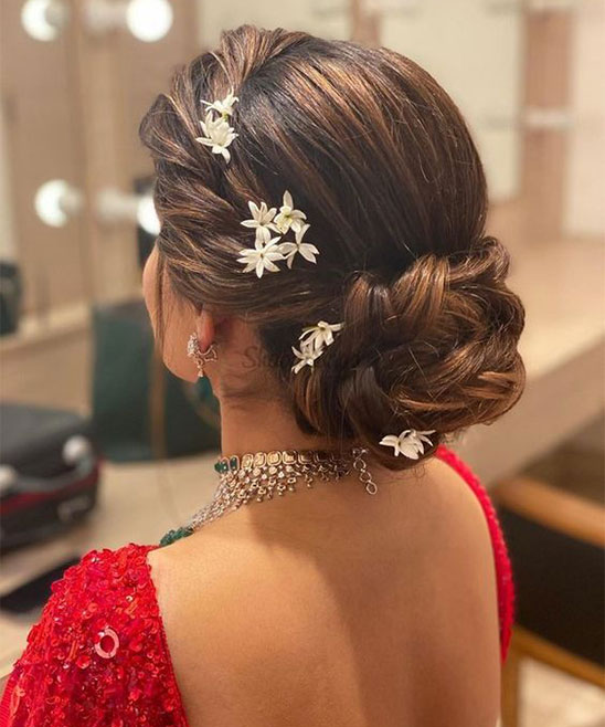 Low messy bun hair do with colourful flower Garland that customised for the  saree colour 😍 #hairstyles #hairdo #hairdowedding #indianbride … |  Instagram