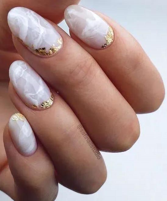 BLACK AND WHITE AND GOLD NAIL DESIGNS