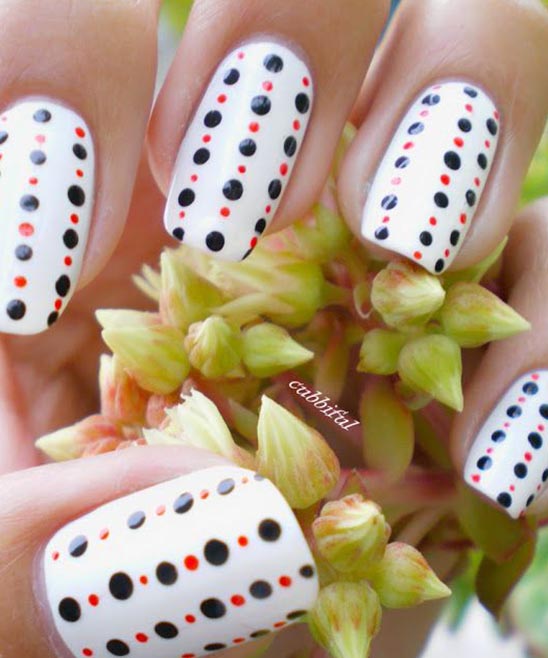 RED NAILS WITH BLACK AND WHITE DESIGNS