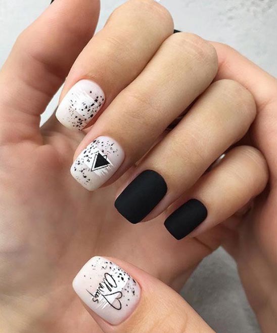 WHITE ACRYLIC NAILS WITH BLACK DESIGN