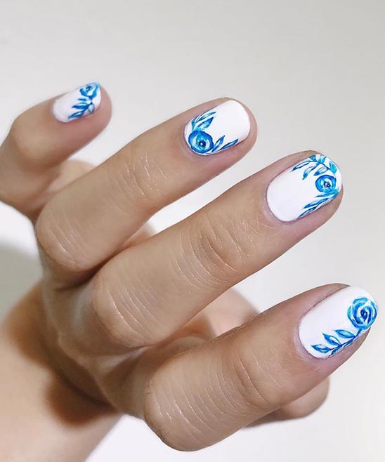 WHITE FRENCH TIP NAILS WITH FLOWER DESIGN