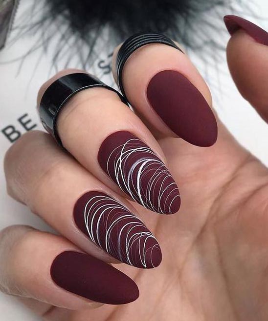 Burgundy Nails With Gold Line