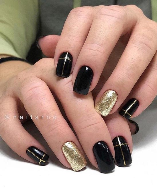 Elegant Black and Gold Nails