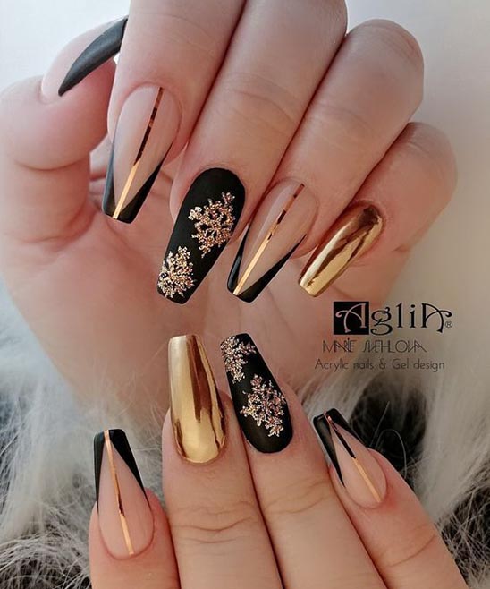 Matte Black and Gold Stiletto Nails