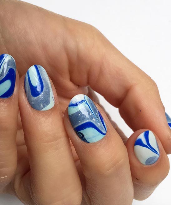 White and Gold Marble Nails