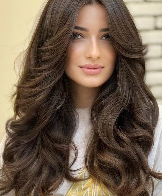 Long Haircuts for Women With Wavy Hair With Sideswept Bangs